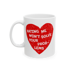 White ceramic No Hate Mug features a distressed red heart with bold white text: “HATING ME WON’T SOLVE YOUR PROBLEMS.” 