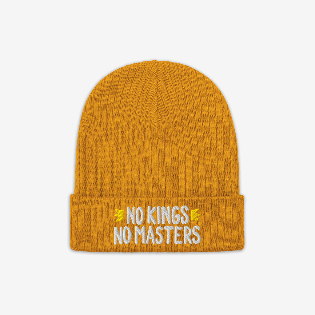 No Kings No Masters Hat featuring a rib-knit design with white embroidered slogan on the cuff, symbolizing rebellion and individuality against oppressive systems.