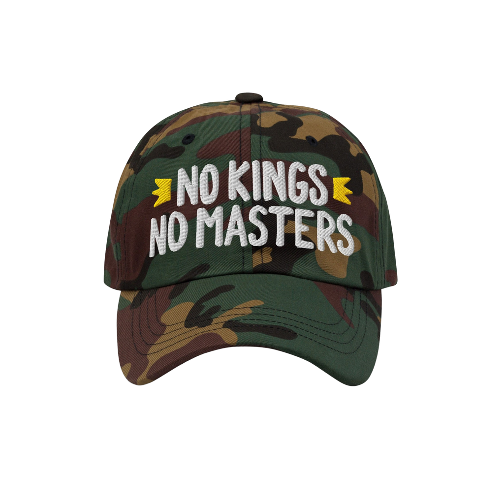 The No Kings No Masters Hat features a camouflage design with bold white embroidery and yellow crown accents, embodying rebel