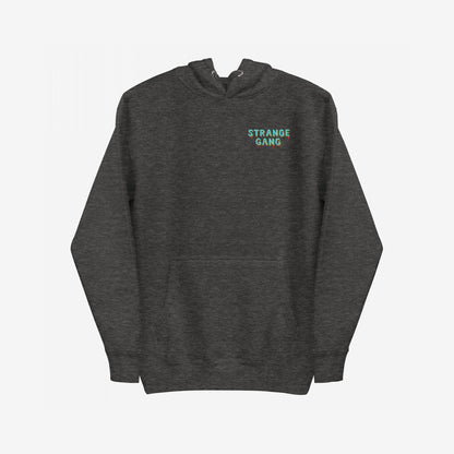 Dark charcoal-gray No Kings No Masters Hoodie featuring a small front graphic, STRANGE GANG. With a kangaroo pocket and bold back print, it embodies rebellion against power and supports equality.