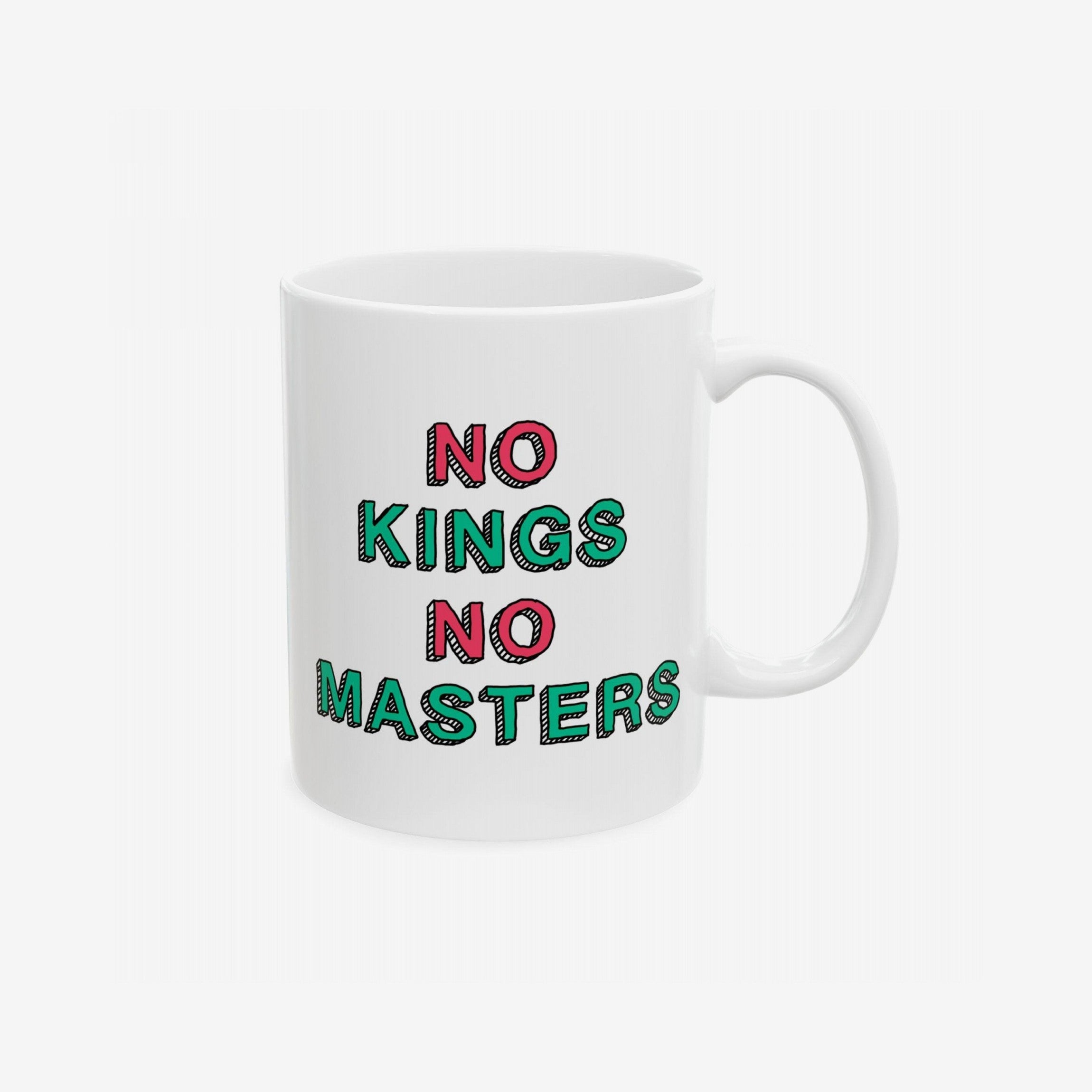 The No Kings No Masters Mug features hand-lettered “NO KINGS NO MASTERS” in pink and green, perfect for those embracing defiance and social justice, dishwasher-safe and available in two sizes.