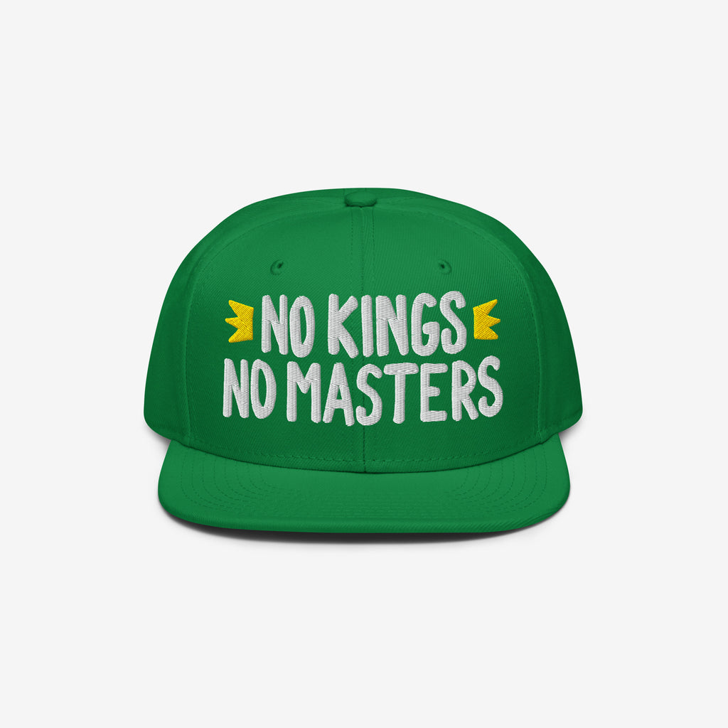 Green flat-brim cap with NO KINGS NO MASTERS slogan and yellow crown icons. This No Kings No Masters Hat embodies rebellious spirit and anti-authoritarian style, supporting the SPLC cause.