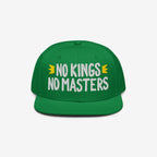 Green flat-brim cap with NO KINGS NO MASTERS slogan and yellow crown icons. This No Kings No Masters Hat embodies rebellious spirit and anti-authoritarian style, supporting the SPLC cause.