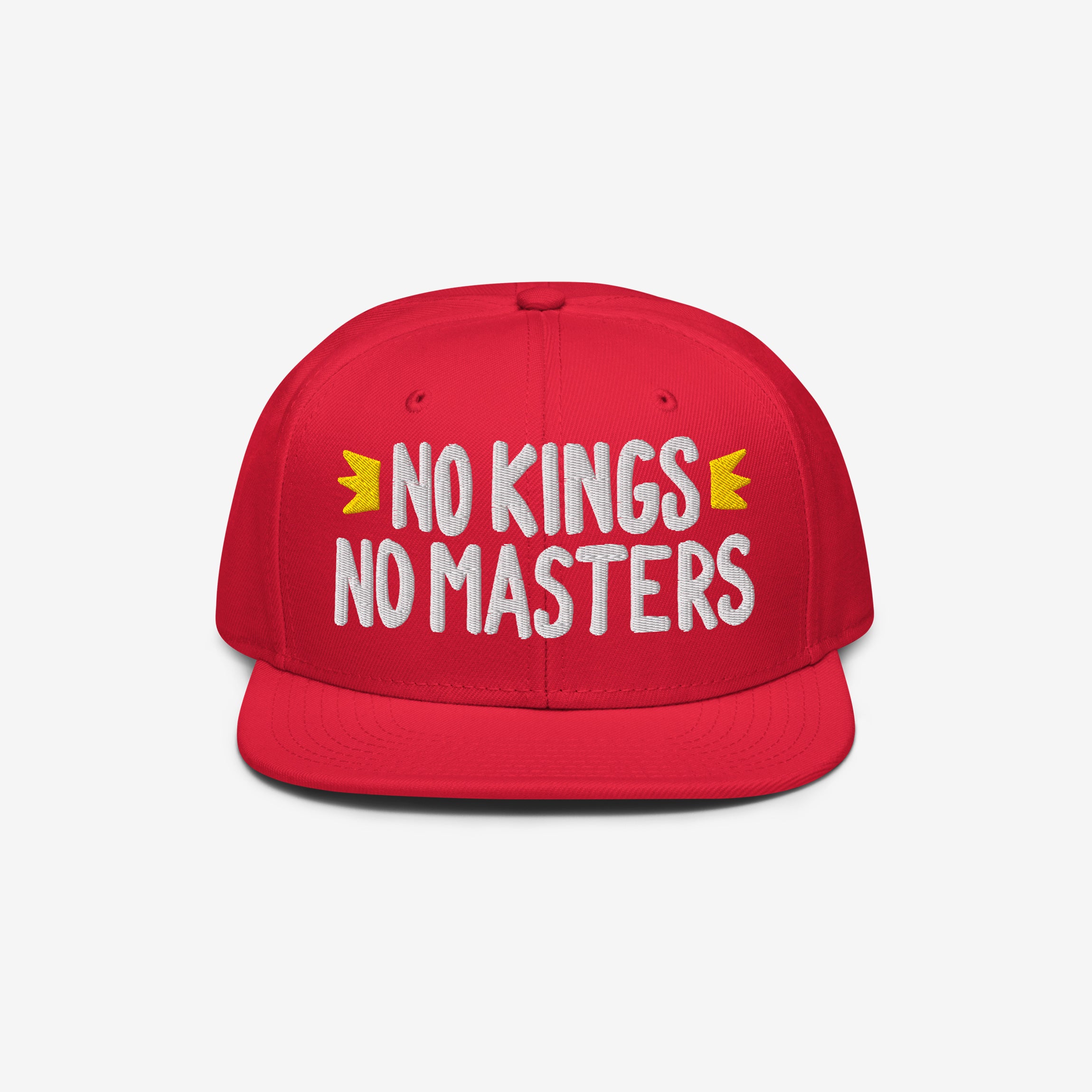 No Kings No Masters Hat with bold white slogan and yellow crown motifs, symbolizing defiance against authority. Ideal for stylish anarchists and rebels, supporting SPLC's mission for equality.