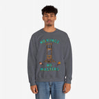 Young man wearing a No Kings No Masters sweatshirt featuring a cartoon-style guillotine and dripping severed heads, symbolizing anti-authoritarian defiance against fascism and oligarchy. Paired with casual blue jeans.