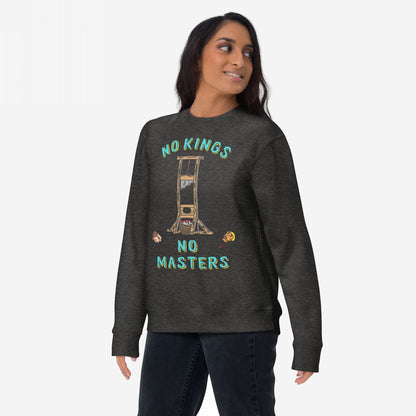 Model wearing 'No Kings No Masters' crewneck sweatshirt, featuring a stylized guillotine graphic with NO KINGS and NO MASTERS text, cartoon heads, and red splatter, symbolizing anti-authoritarian sentiment.