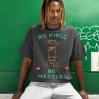 Person with dreadlocks wearing the No Kings No Masters Shirt featuring a bold guillotine graphic and severed heads, symbolizing anti-authoritarian defiance and resistance. Ideal for those challenging authority.