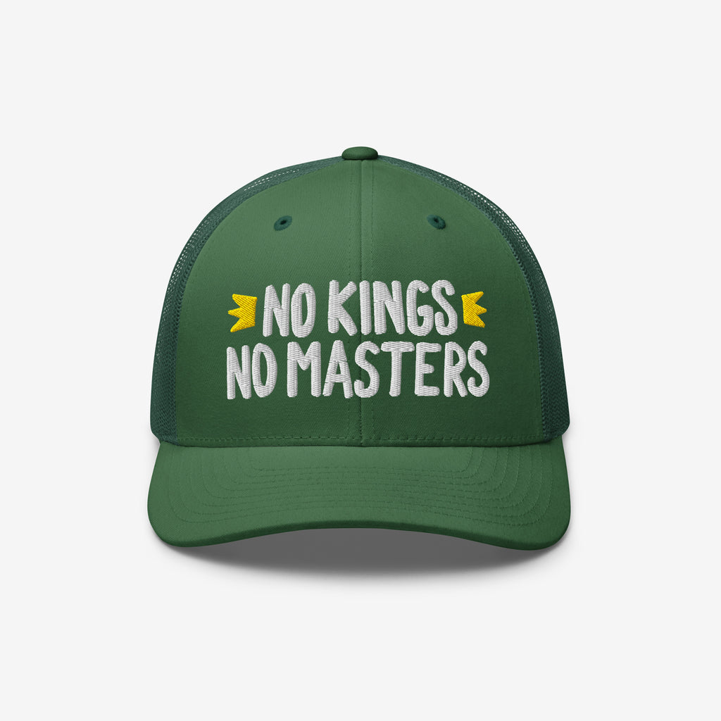 The No Kings No Masters Hat is a green trucker-style cap featuring white embroidery with the phrase NO KINGS NO MASTERS and yellow accents, embodying a rebellious, anti-authoritarian spirit.