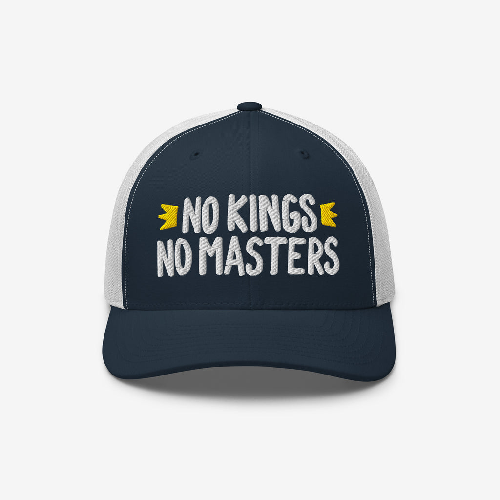 No Kings No Masters Hat featuring bold white embroidery on a navy cap with white mesh, symbolizes rebellion and individuality with yellow crown accents, embodying a defiant spirit against authority.