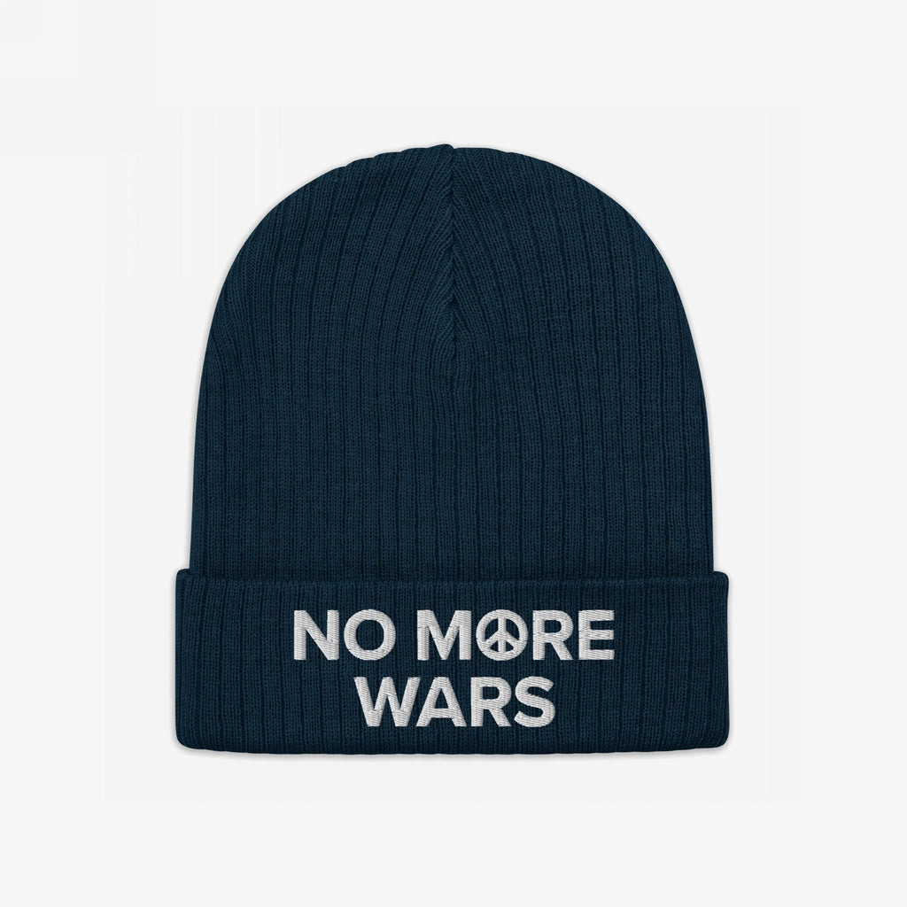 No More Wars Hat: Dark-navy beanie with NO MORE WARS embroidered in white, featuring a peace-symbol icon in “MORE.” A bold statement against war, promoting peace and equality.