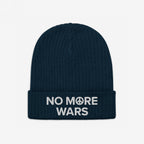 No More Wars Hat: Dark-navy beanie with NO MORE WARS embroidered in white, featuring a peace-symbol icon in “MORE.” A bold statement against war, promoting peace and equality.