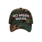 No More Wars Hat featuring woodland-camouflage design and bold white embroidery with a peace symbol, symbolizing a powerful s