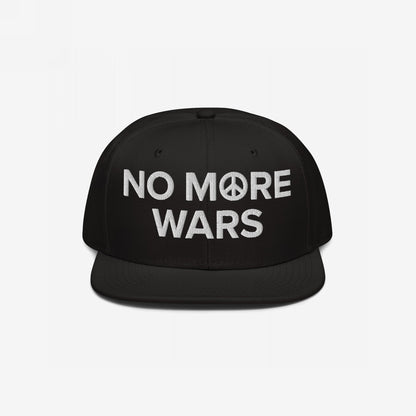 No More Wars Hat: A black snapback cap featuring “NO MORE WARS” embroidered in white with a peace-symbol icon, promoting anti-war sentiments, suitable for activism and everyday wear.