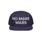 No More Wars Hat featuring a navy snapback design with NO MORE WARS and a peace symbol embroidered in white, symbolizing a st