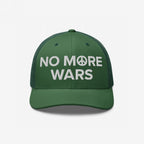 The No More Wars Hat prominently displays a peace-driven message with NO MORE WARS embroidered in white, featuring a peace symbol, set against a mesh-back design on a green baseball cap.
