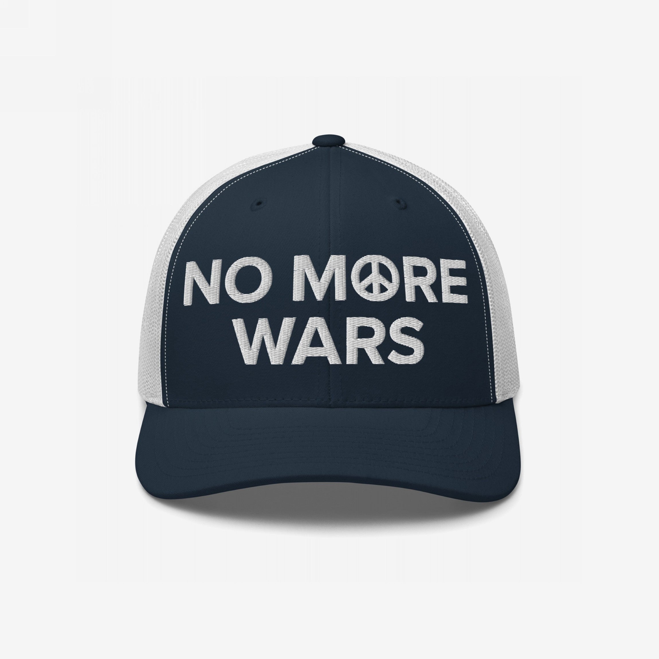 No More Wars Hat featuring navy-blue front, white mesh back, with NO MORE WARS embroidered, peace symbol as the O, promoting peace and resistance against war profiteering.