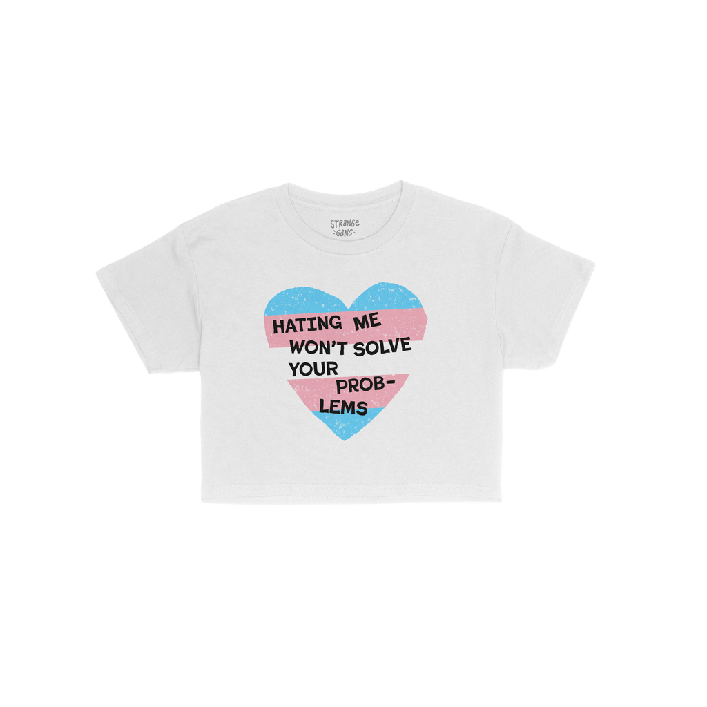 No Trans Hate Women's Baby Tee features a distressed heart in trans flag colors with the slogan HATING ME WON'T SOLVE YOUR PR