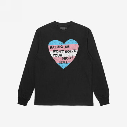 No Trans Hate T-shirt features a bold, distressed heart graphic in trans pride colors with the message “HATING ME WON’T SOLVE YOUR PROBLEMS,” symbolizing strength and unapologetic identity.