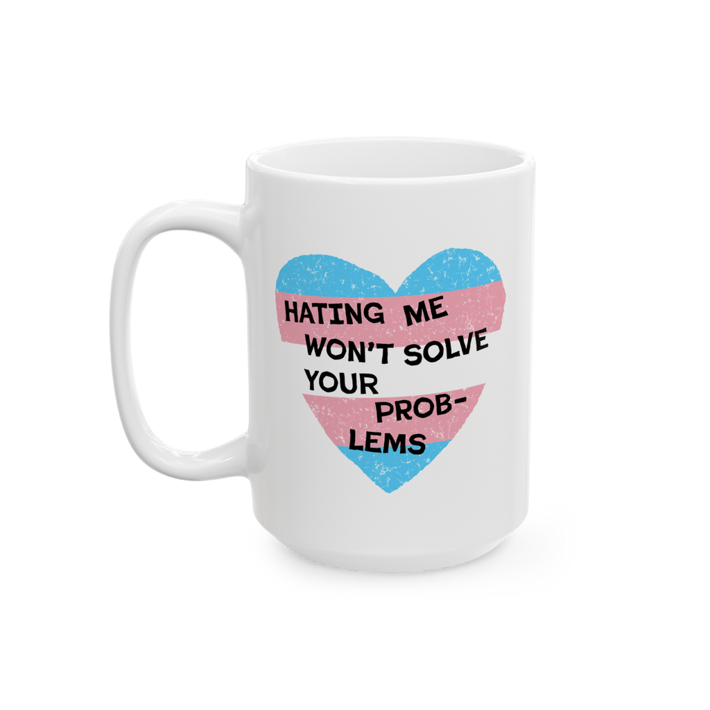 No Trans Hate Mug features a white ceramic design with a heart graphic in transgender-pride colors, overlaid with the phrase 