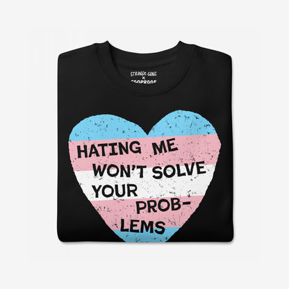 No Trans Hate Hoodie & Sweatshirt featuring a black crew-neck T-shirt with a large heart graphic in transgender-pride colors and bold text stating “HATING ME WON’T SOLVE YOUR PROBLEMS” for a defiant, proud statement.