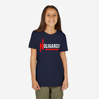 Young girl smiling, wearing a navy-blue No Oligarchy Shirt with bold red N and OLIGARCHY slogan, symbolizing rebellion against elite power, aligning with anti-establishment themes.