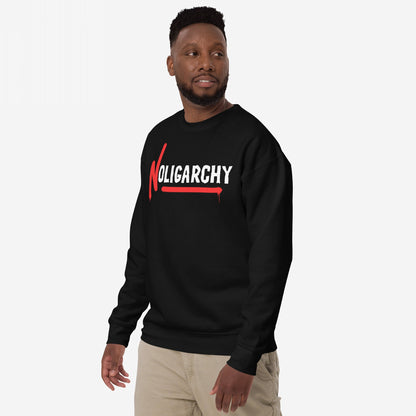 Male model wearing No Oligarchy Hoodie & Sweatshirt featuring bold white graffiti-style font with red accents. The design symbolizes resistance against elite rule, aligning with values of equality and empowerment.
