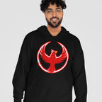 A young man wears the Northern Cardinal Rebel Alliance Hoodie, featuring a bold red phoenix emblem on a black pullover, embodying a message of resistance and equality.