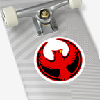 Northern Cardinal Rebel Alliance Sticker on a skateboard deck's tail end, featuring a red phoenix with outstretched wings inside a black circle, symbolizing protest and solidarity.
