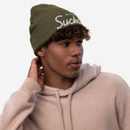 Young man wearing a Not Drinking Sucks knit beanie, featuring white embroidered text, capturing a bold, playful vibe perfect for expressing a carefree, social attitude.
