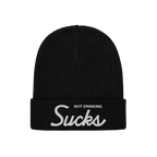 Black rib-knit beanie with Not Drinking Sucks embroidered on the cuff, capturing a bold, playful vibe. Reflects an unapologet