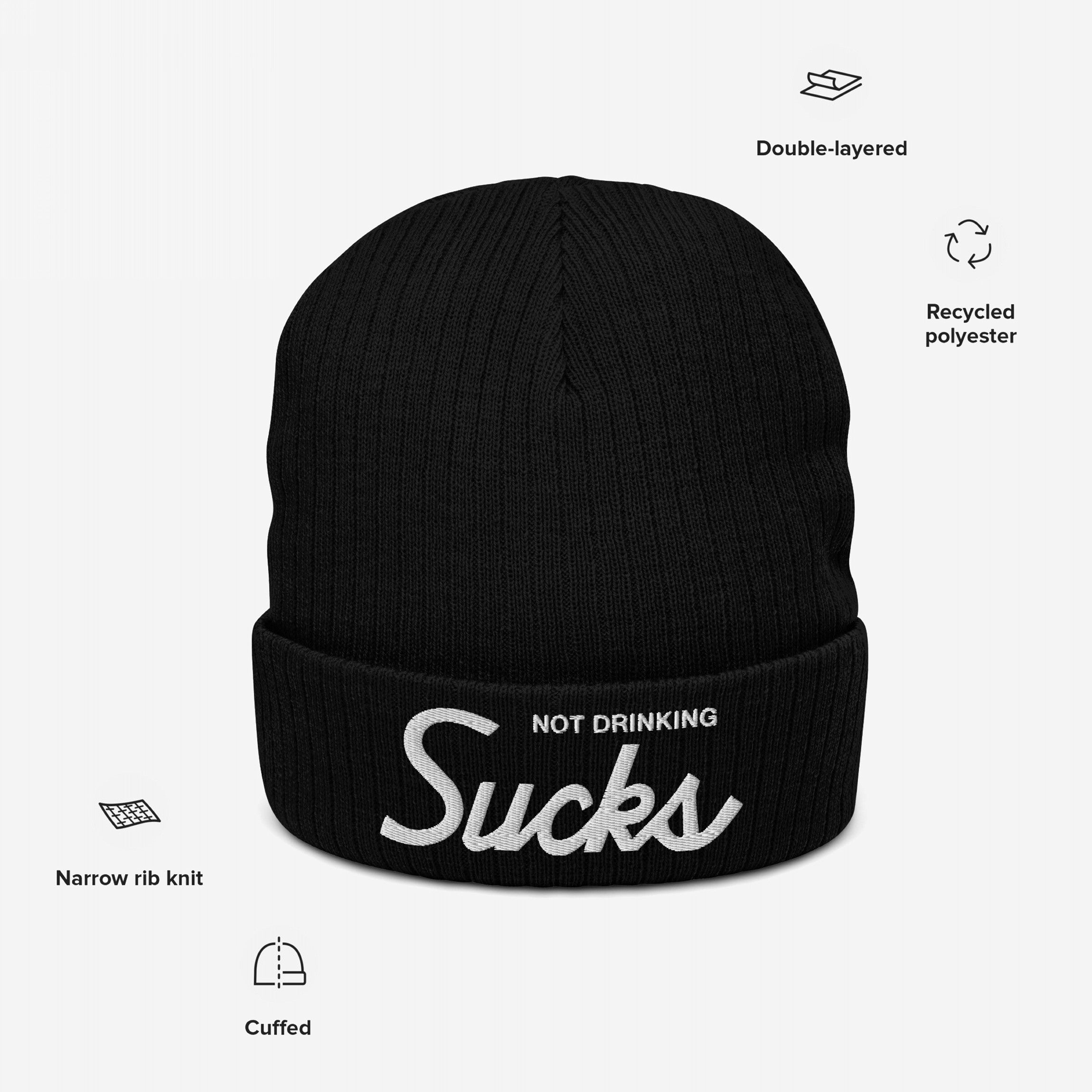 Not Drinking Sucks Hat: Black cuff-style knit beanie with white embroidered slogan, crafted from recycled polyester. Perfect for expressing bold, playful vibes at social gatherings.