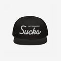 Not Drinking Sucks Hat with white embroidery on the front panel, featuring a bold retro script. A playful statement piece for parties, embodying a carefree, inclusive vibe. Snapback style, perfect for casual outings.