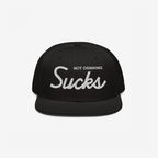 Not Drinking Sucks Hat with white embroidery on the front panel, featuring a bold retro script. A playful statement piece for parties, embodying a carefree, inclusive vibe. Snapback style, perfect for casual outings.