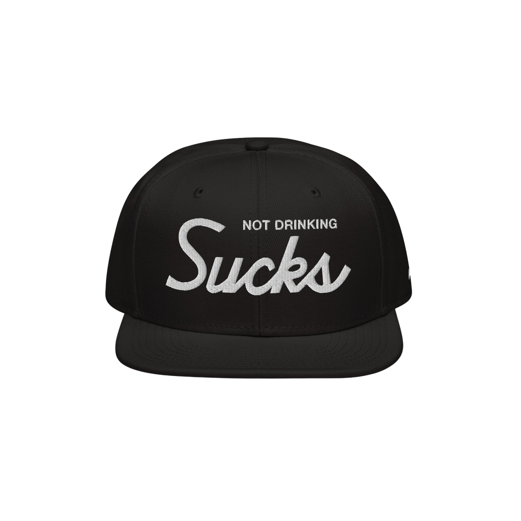 Not Drinking Sucks Hat with white embroidery on the front panel, featuring a bold retro script. A playful statement piece for