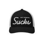 The Not Drinking Sucks Hat features a black front with bold “Not Drinking Sucks” embroidery. This playful trucker cap emb