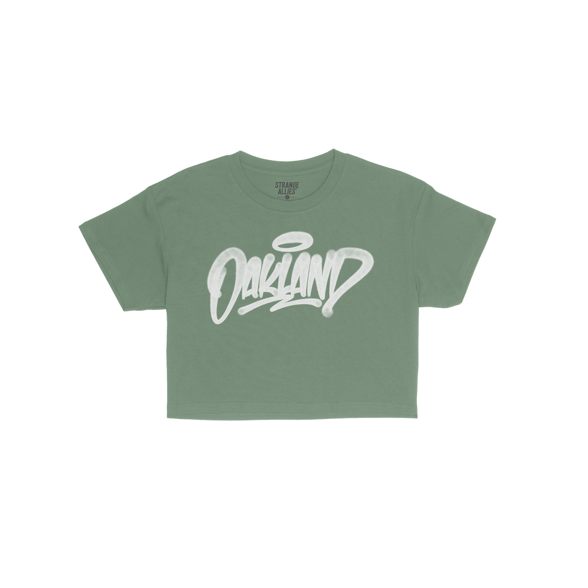 Oakland Handstyle Women's Baby Tee featuring a stylized white Oakland graffiti logo with a halo tag on a green short-sleeved 