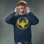 Oregon Rebel Alliance Hoodie & Sweatshirt modeled by a young man adjusting round glasses, featuring a distressed golden phoenix design, embodying anti-fascist spirit and community support against a gray backdrop.