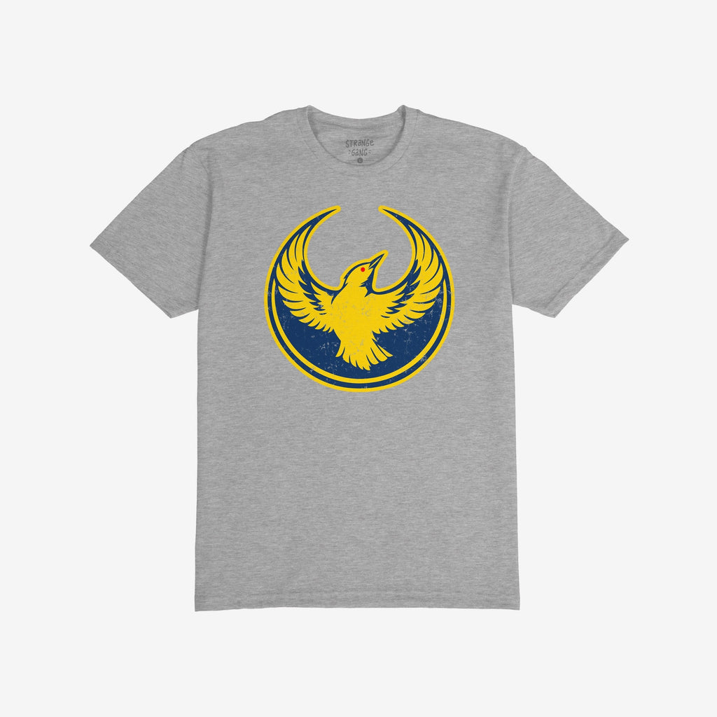 Oregon Rebel Alliance T-shirt featuring a stylized yellow bird emblem with raised wings against a blue circle. Ideal for anti-fascist supporters and immigrant rights advocates, reflecting values and activism.