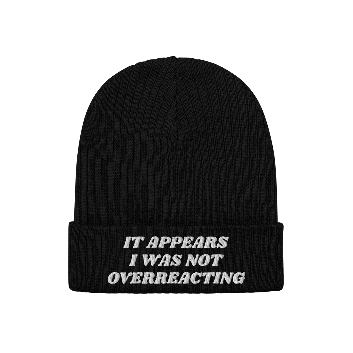 Black rib-knit beanie titled Overreacting Hat, featuring white embroidery on the cuff with the phrase “IT APPEARS I WAS NOT