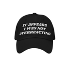 Black Overreacting Hat with white embroidered text, IT APPEARS I WAS NOT OVERREACTING, signifies anti-fascist sentiment. Idea