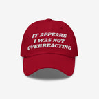 The Overreacting Hat features bold white embroidery stating “IT APPEARS I WAS NOT OVERREACTING,” designed for those opposing fascism and supporting equality. Ideal for progressive expressions and activism.