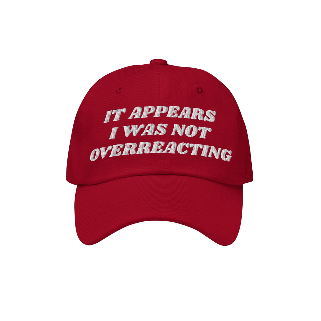 The Overreacting Hat features bold white embroidery stating “IT APPEARS I WAS NOT OVERREACTING,” designed for those oppos