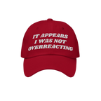 The Overreacting Hat features bold white embroidery stating “IT APPEARS I WAS NOT OVERREACTING,” designed for those oppos