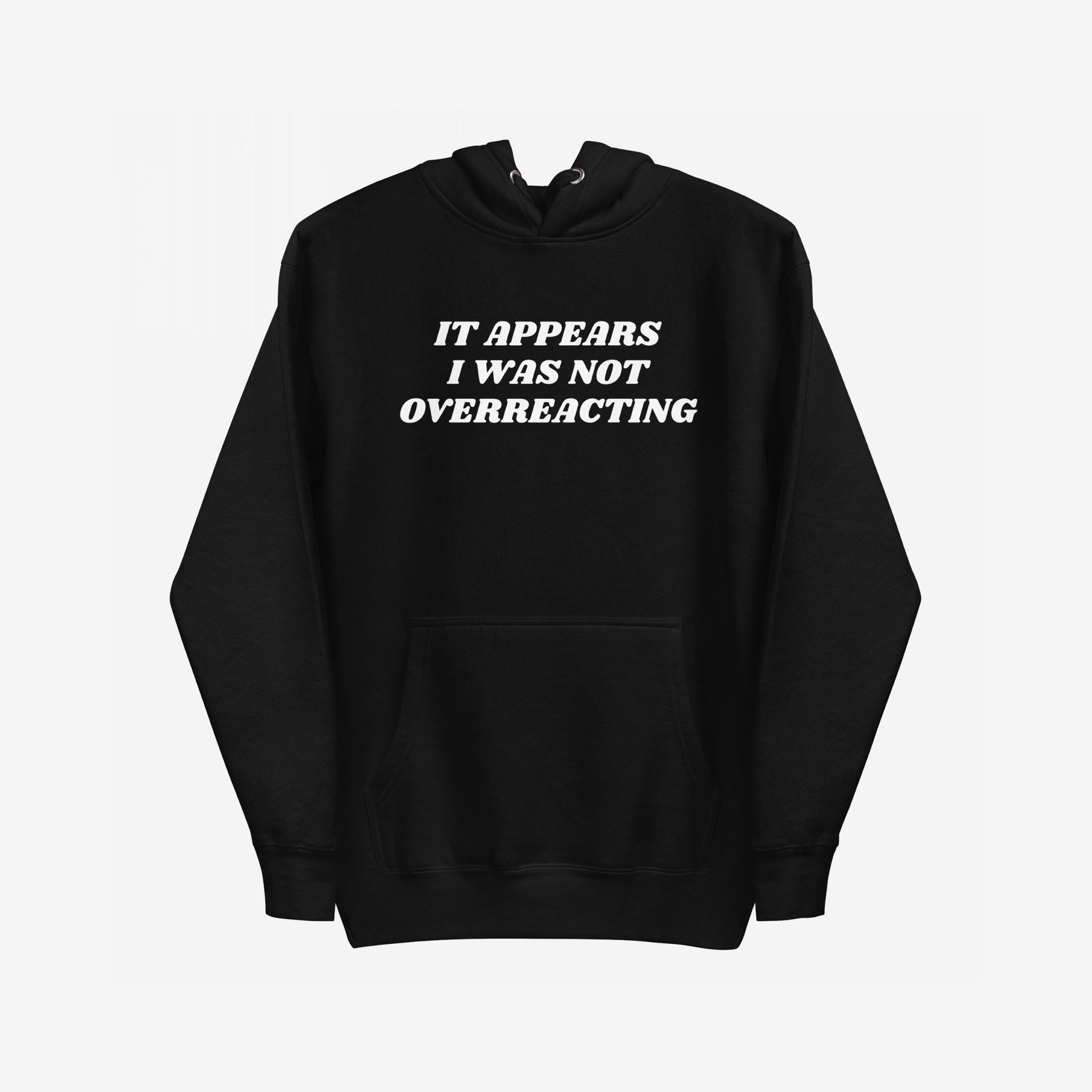 Overreacting Hoodie & Sweatshirt features bold white text asserting IT APPEARS I WAS NOT OVERREACTING, on a black pullover, embodying resistance and truth against oppression. Perfect for those challenging systemic injustices.
