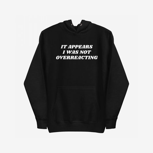 Overreacting Hoodie & Sweatshirt features bold white text asserting IT APPEARS I WAS NOT OVERREACTING, on a black pullover, embodying resistance and truth against oppression. Perfect for those challenging systemic injustices.