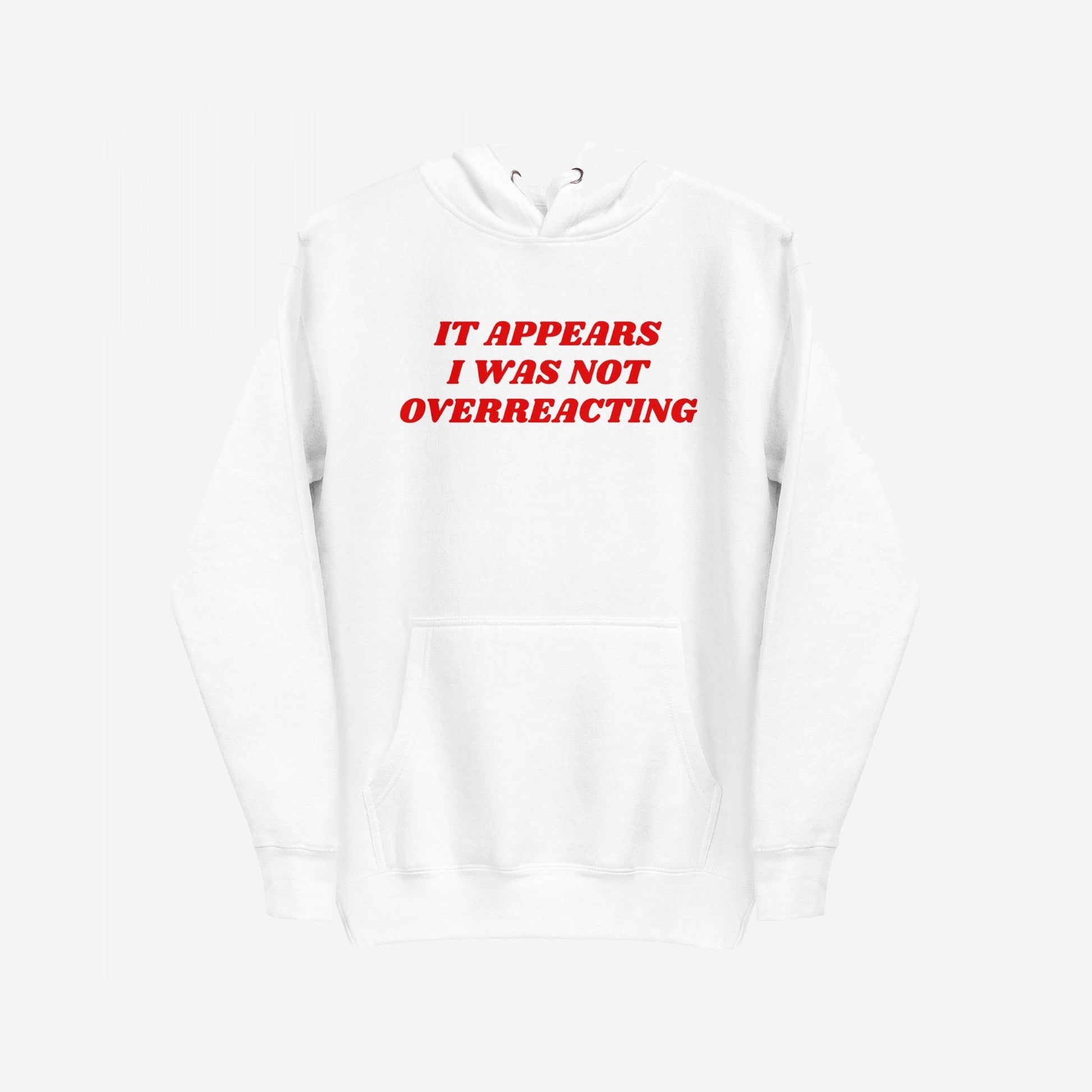 Overreacting Hoodie & Sweatshirt features bold red text declaring, “IT APPEARS I WAS NOT OVERREACTING.” This plain white pullover embodies resistance, advocating against oppressive systems with its striking message.