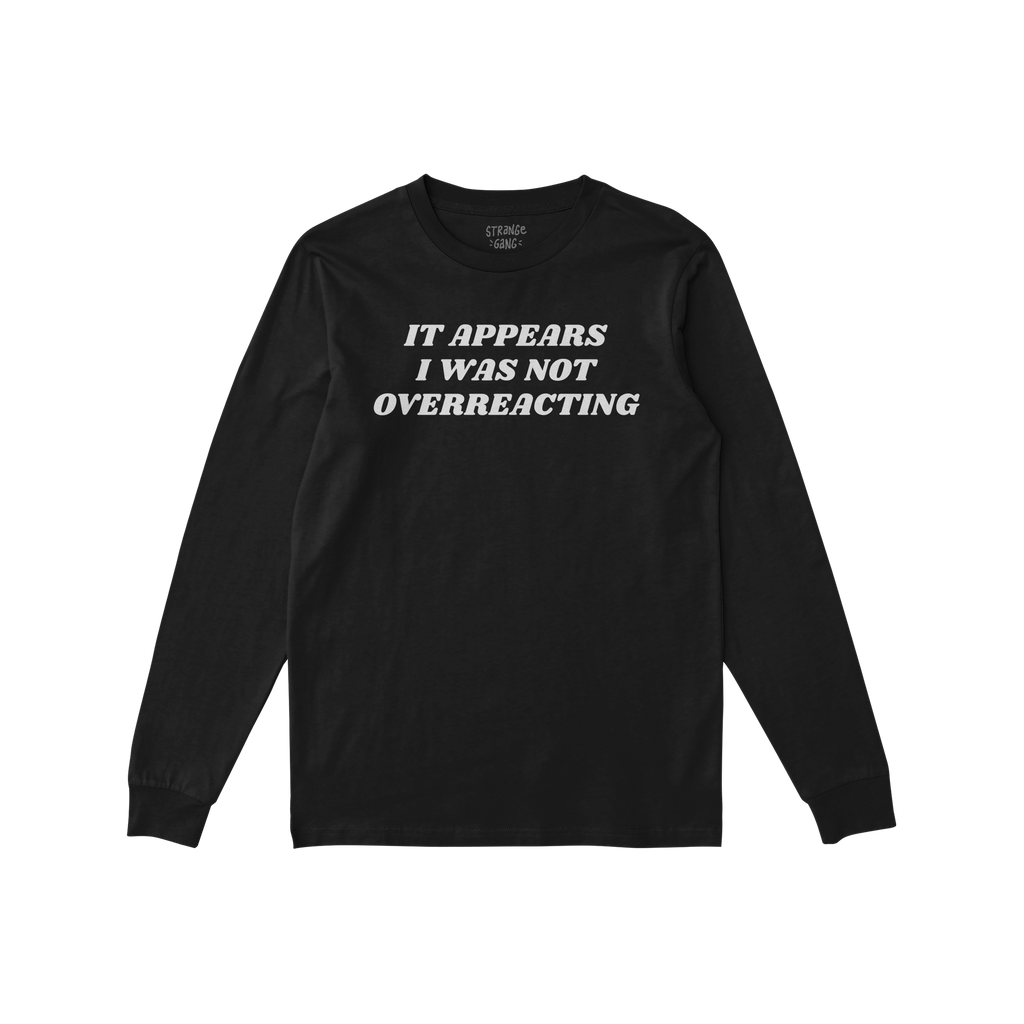The Overreacting Shirt, a black long-sleeve crewneck, features bold white lettering stating It appears I was not overreacting
