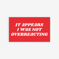 Overreacting Sticker & Magnet design shows a red rectangle with bold text, against a backdrop of masked protestors behind caution tape, emphasizing resistance. A callout highlights the choice between magnet or sticker.