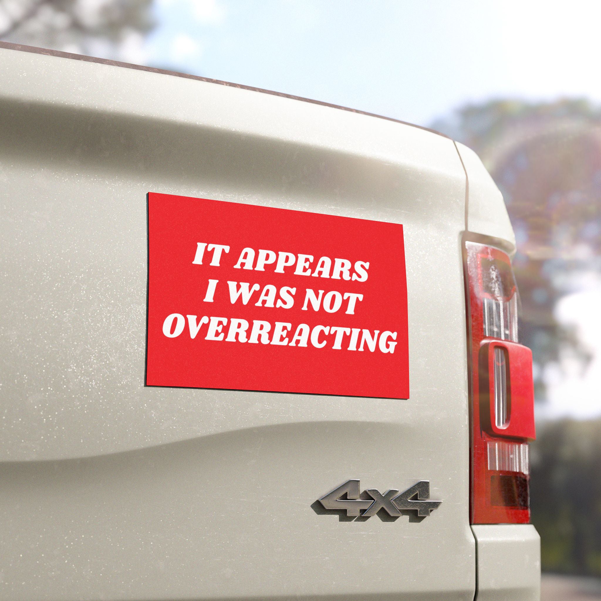 The rear of a light-colored 4x4 vehicle displays the Overreacting Sticker & Magnet, featuring bold white text on a red background that reads, “It appears I was not overreacting.”