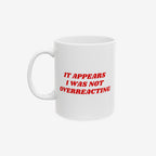 White ceramic Overreacting Mug with bold red text stating, It Appears I Was Not Overreacting, symbolizing resistance against fascism. Ideal for activists, it supports ACLU with every purchase.